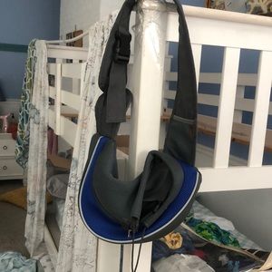 Puppy holder for small dogs. Adjustable straps very convenient